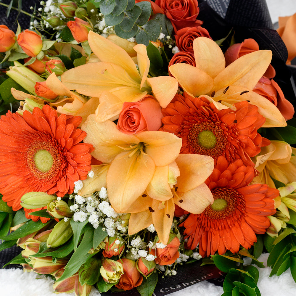 Mixed rose bouquet in red, yellow, and orange. Same Day New Jersey Delivery