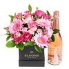 Boundless Cheer Flowers & Champagne Gift, pink roses, gerbera, spray roses, mini carnations, and greens in a square black designer hat box, bottle of Sparkling Wine, Mixed Floral Gifts from Blooms New Jersey - Same Day New Jersey Delivery.