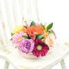 Celebrating Her Flower Gift, vivid hues, including cheerful gerbera, regal roses, radiant alstroemeria, and ruscus, elegantly arranged in a stylish short pink designer hat box, Mixed Floral Gifts from Blooms New Jersey - Same Day New Jersey Delivery.