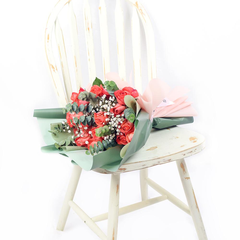 Coral Rose Dream Bouquet, beautiful selection of coral roses, baby’s breath, and eucalyptus in floral wrap with a designer ribbon, Flower Gifts from Blooms New Jersey - Same Day New Jersey Delivery.