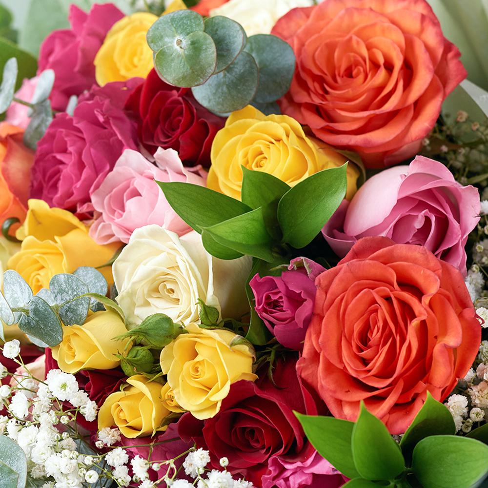 Daydream Fantasy Rose Bouquet, multicolored roses, spray roses with baby’s breath, eucalyptus, and ruscus, gathered in a floral wrap and tied with a designer ribbon, Mixed Flower Gifts from Blooms New Jersey - Same Day New Jersey Delivery.