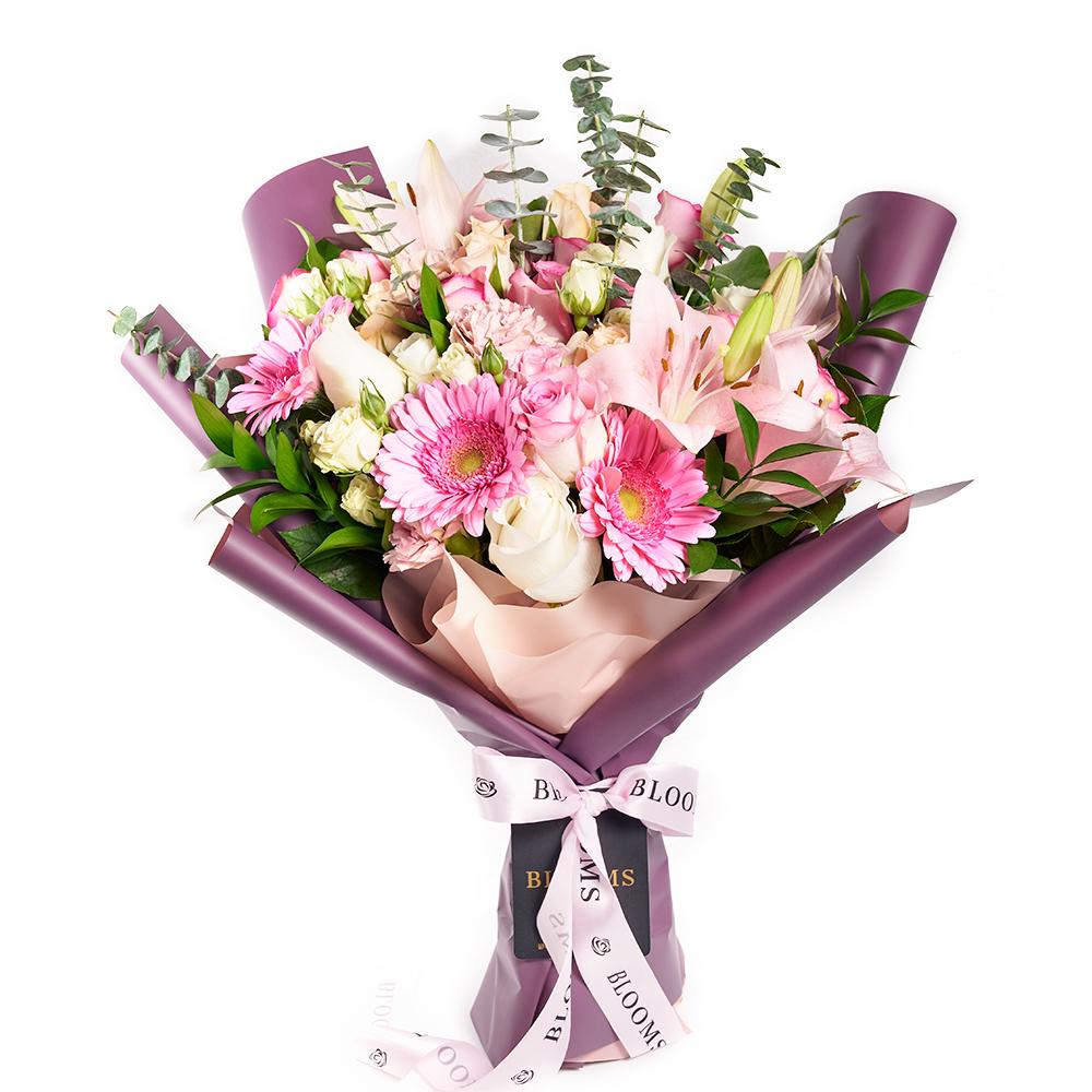Pastel Pink Variety Bouquet, pastel roses, spray roses, lilies, gerbera, carnations, and eucalyptus in a floral wrap and tied with designer ribbon, Mixed Floral Gifts from Blooms New Jersey - Same Day New Jersey Delivery.