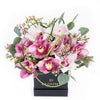 Softly Pink Orchid Box Arrangement, includes pink and white cymbidium orchids and wax flowers in a black square hat box, Flower Gifts from Blooms New Jersey - Same Day New Jersey Delivery.
