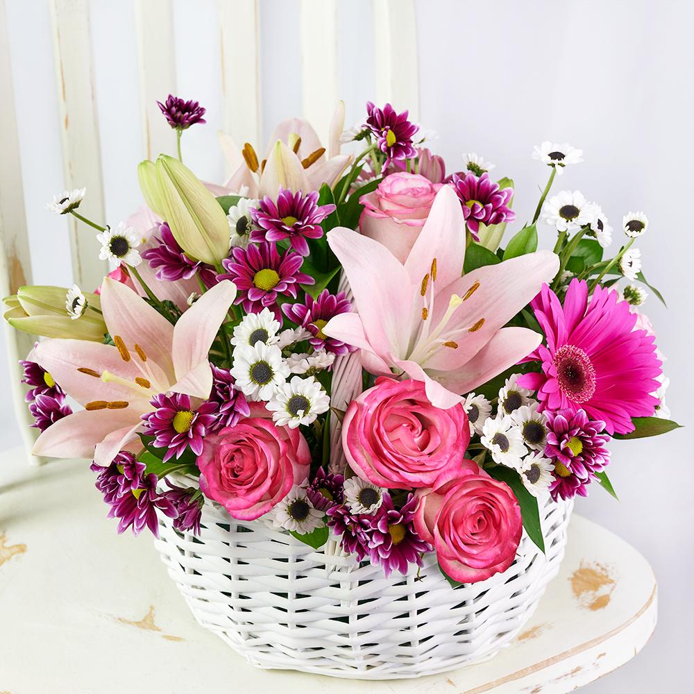 Suddenly Spring Mother’s Day Floral Gift, roses, daisies, lilies, gerbera, and greens in a charming white wicker basket, Floral Gifts from Blooms New Jersey - Same Day New Jersey Delivery.