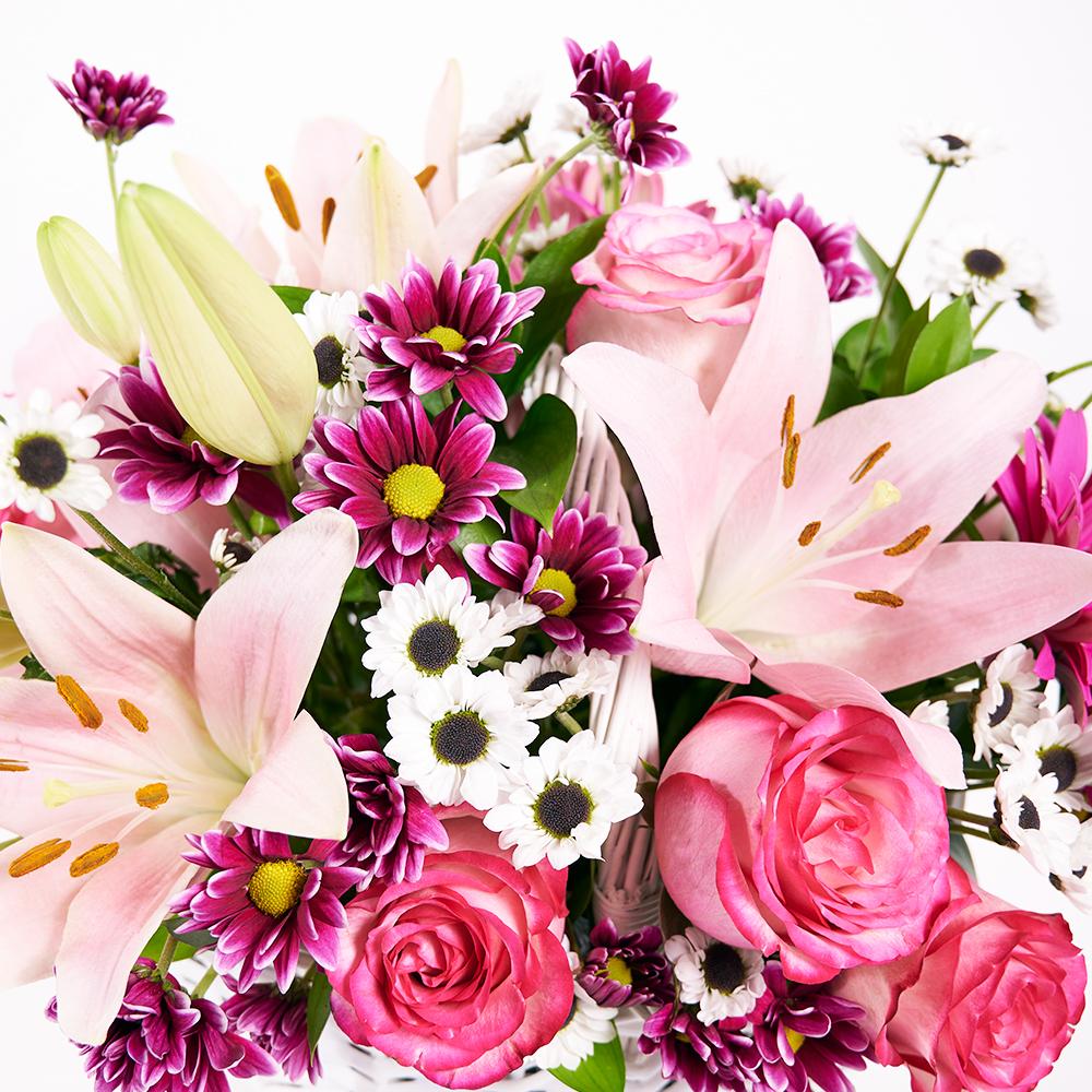 Suddenly Spring Mother’s Day Floral Gift, roses, daisies, lilies, gerbera, and greens in a charming white wicker basket, Floral Gifts from Blooms New Jersey - Same Day New Jersey Delivery.