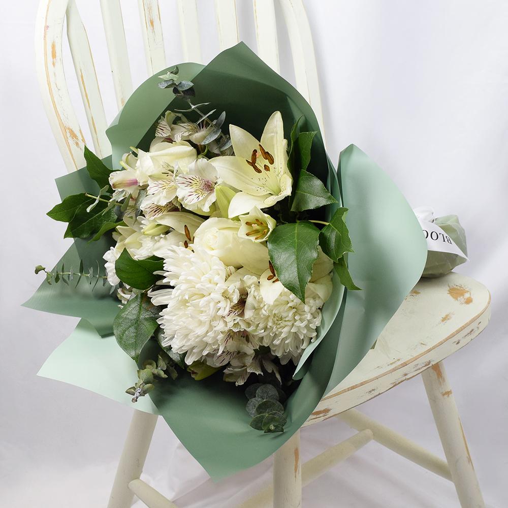 The Sweet Talk Mother's Day Floral Gift, election of white roses, lilies, alstroemeria, spider chrysanthemums, mini carnations, eucalyptus, baby’s breath, and ruscus in a floral wrap and tied with a designer ribbon, Floral Gifts from Blooms New Jersey - Same Day New Jersey Delivery.