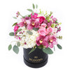 Thinking of You Box Arrangement, cymbidium orchids, roses, spray roses, alstroemeria, and wax flowers in a round black hat box, Mixed Floral Gifts from Blooms New Jersey - Same Day New Jersey Delivery.