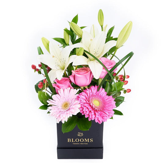 Vivid Mixed Floral Arrangement, vibrant roses, lilies, gerbera, and hypericum berries arranged in a black designer hat box, Mixed Floral Gifts from Blooms New Jersey - Same Day New Jersey Delivery.
