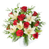 Winter Flower Arrangement, red roses, lilies, chrysanthemums, and greens in a ceramic pot, floral gifts from Blooms New Jersey - Same Day New Jersey Delivery.