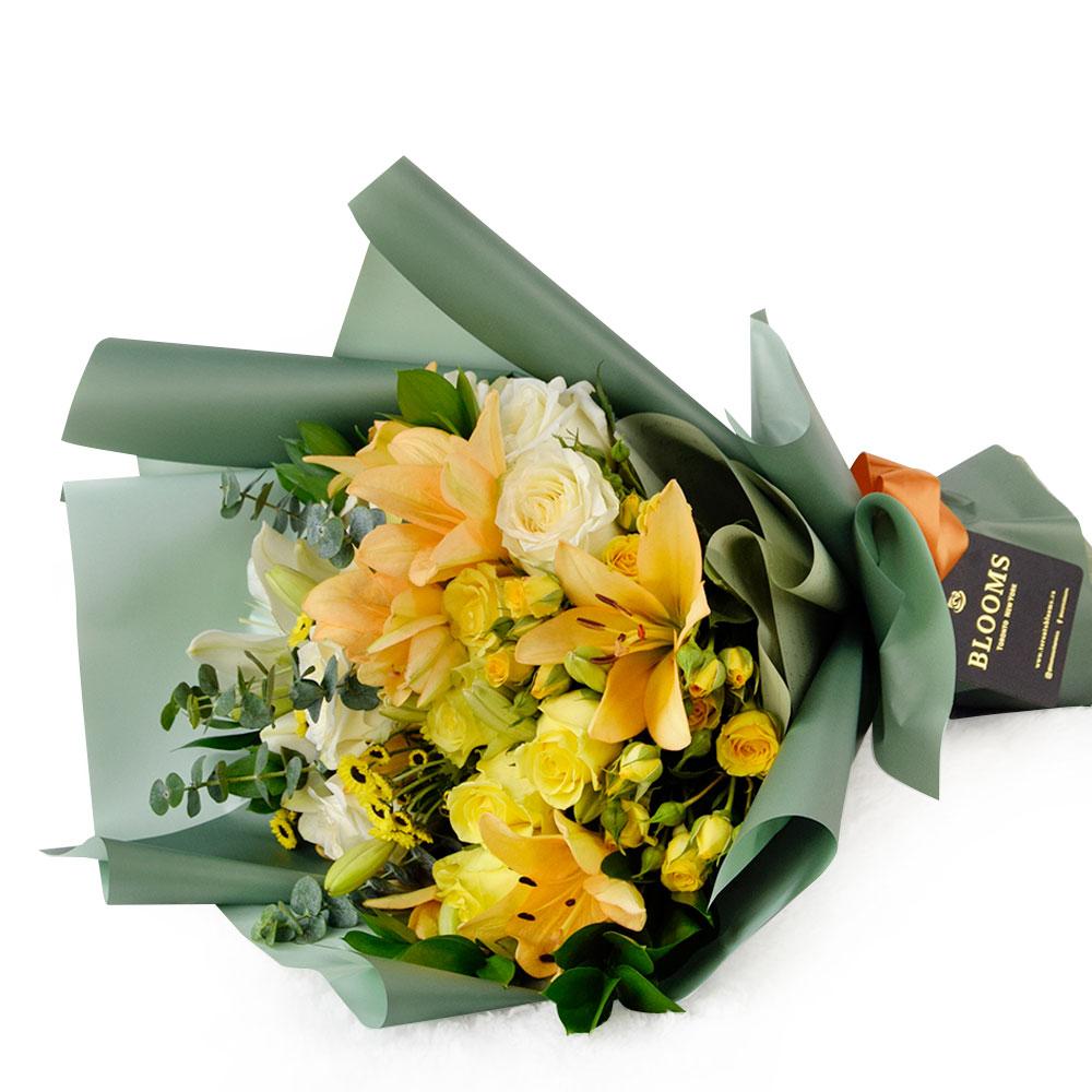 Floral Sunrise Mixed Bouquet & Champagne, roses, daisies, and lilies along with eucalyptus and ruscus in a floral wrap with designer ribbon, bottle of Sparkling Wine, Floral Gifts from Blooms New Jersey - Same Day New Jersey Delivery.