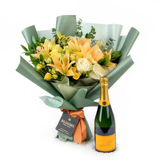 Floral Sunrise Mixed Bouquet & Champagne, roses, daisies, and lilies along with eucalyptus and ruscus in a floral wrap with designer ribbon, bottle of Sparkling Wine, Floral Gifts from Blooms New Jersey - Same Day New Jersey Delivery.