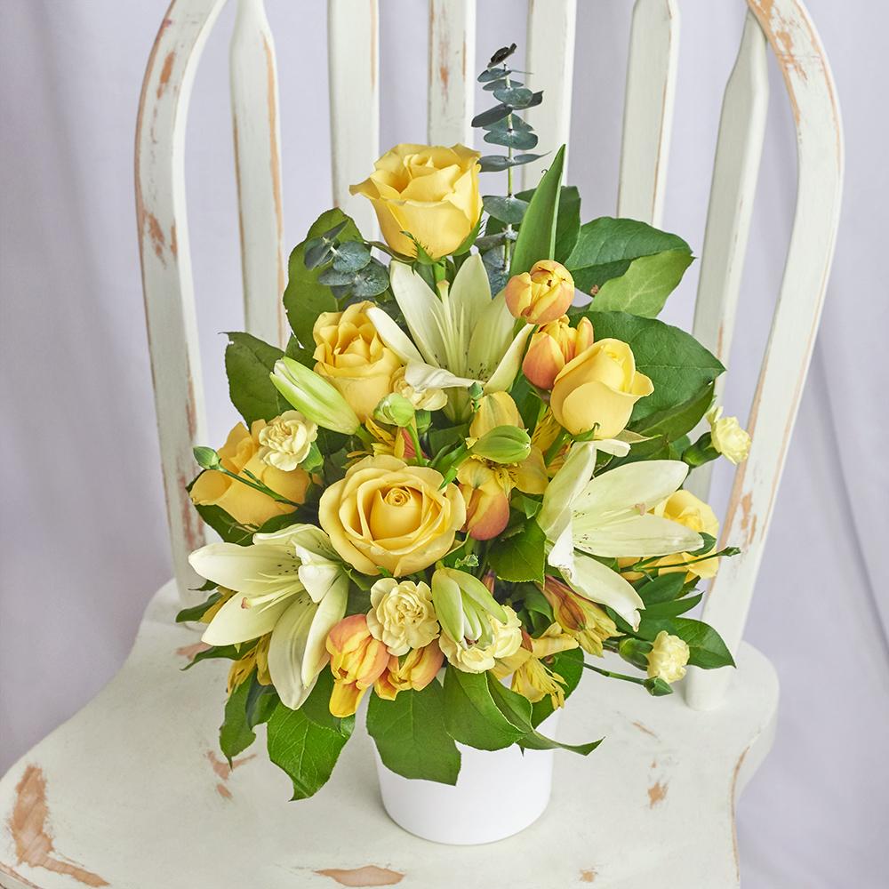 Gold & Cream Mixed Arrangement, pale yellow and cream-coloured alstroemeria, lilies, roses, tulips, mini carnations, salal, and eucalyptus in a modern white ceramic pot, Mixed Floral Gifts from Blooms New Jersey - Same Day New Jersey Delivery.