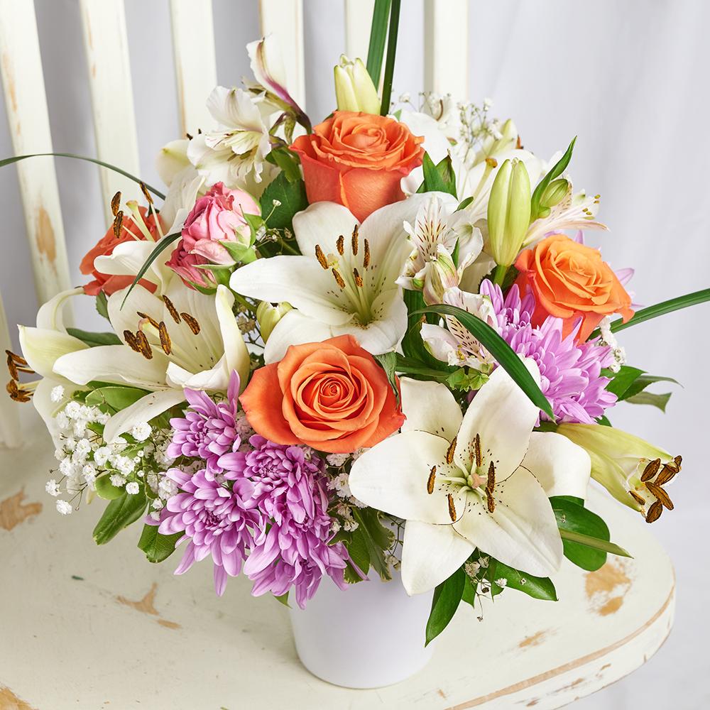Heavenly Scents Flowers & Candle Gift, roses, daisies, lilies, alstroemeria, and greens in a ceramic vessel, Lavender scented candle, Mixed Floral Gifts from Blooms New Jersey - Same Day New Jersey Delivery.