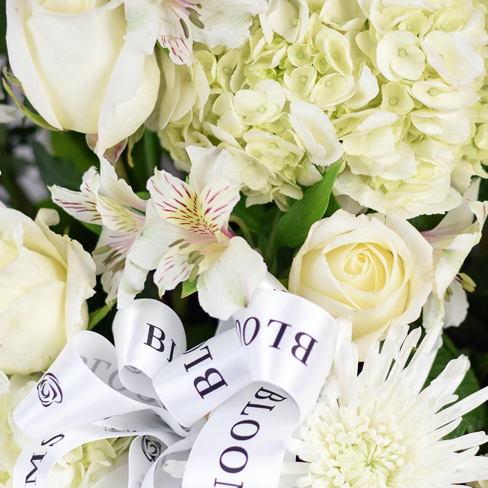 Luminous Mixed Flower Arrangement, lovely arrangement of white alstroemeria, spider chrysanthemums, roses, hydrangeas, and salal in a contrasting dark wicker basket, Mixed Floral Gifts from Blooms New Jersey - Same Day New Jersey Delivery.