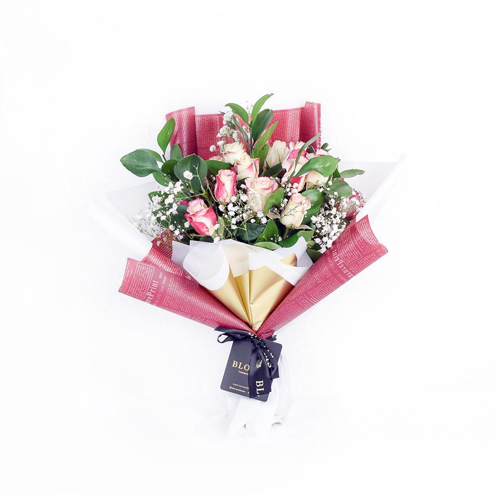 Magical Fantasy Rose Bouquet, bunch of white and pink ombre roses, baby’s breath, and salal. It is gathered in a floral wrap and tied with designer ribbon, Flower Gifts from Blooms New Jersey - Same Day New Jersey Delivery.