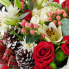 ‘Tis the Season Holiday Box Arrangement, lilies, roses, hydrangea, spider chrysanthemums, chrysanthemums, hypericum berries, mini carnations, large pine cones, Christmas decorations, ribbons, and greens all gathered into a square black designer box, mixed floral gifts from Blooms New Jersey - Same Day New Jersey Delivery.