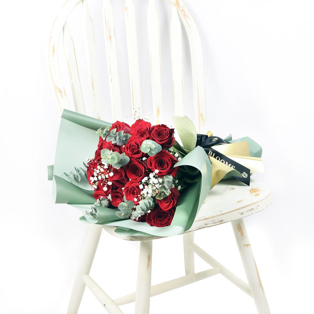 Spread The Cheer Rose Gift, red roses, baby’s breath, and eucalyptus in a floral wrap with designer ribbon, Flower Gifts from Blooms New Jersey - Same Day New Jersey Delivery.