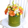 Summer Glow Mixed Arrangement, multi-hued roses, mini roses, lilies, alstroemeria, carnations and daisies in a tall sleek green designer hat box, Mixed Floral Gifts from Blooms New Jersey - Same Day New Jersey Delivery.