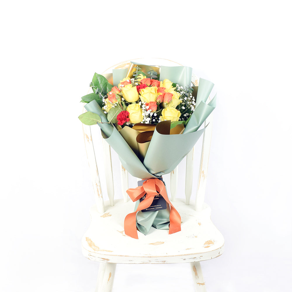 Mother's Day Sunburst Mixed Rose Bouquet, yellow & red roses gathered together in a clear cellophane sheet with a ribbon or designer twine, Flower Gifts from Blooms New Jersey - Same Day New Jersey Delivery.