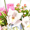 Timeless Orchid & Hydrangea Floral Gift, hydrangea, cymbidium, roses, hypericum berries, green chrysanthemums, and greens in a charming round black hat box, Mixed Floral Gifts from Blooms New Jersey - Same Day New Jersey Delivery.
